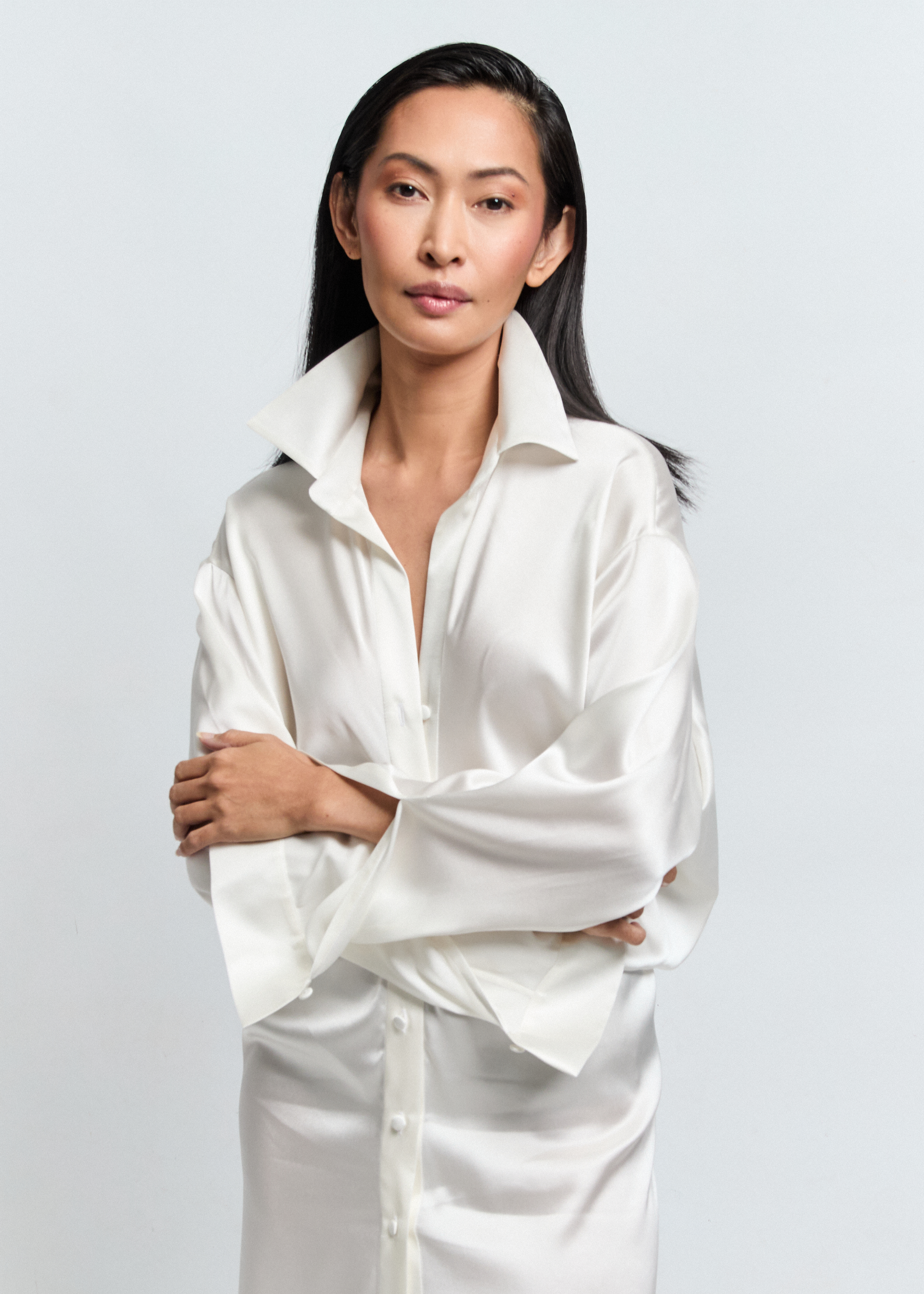 · NOVA silk satin shirt dress with extended shoulder and stand collar — Pohjanheimo · NOVA dress front placket with fabric-covered buttons — Pohjanheimo atelier · NOVA floor-length silk dress — curved panel waist detail, Pohjanheimo Tallinn